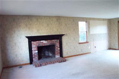 108 Ebenezer Road Osterville, MA 02655 - Photo 14 of 17 an empty room with windows and fireplace