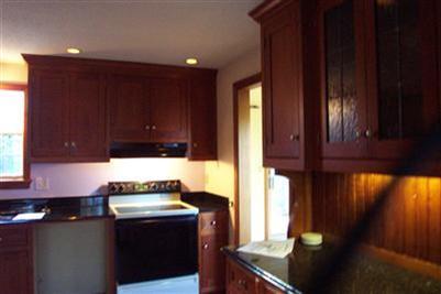 108 Ebenezer Road Osterville, MA 02655 - Photo 2 of 17 a kitchen with a sink cabinets and wooden floor