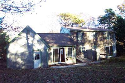 108 Ebenezer Road Osterville, MA 02655 - Photo 4 of 17 a view of a house with a yard and sitting area