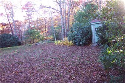 108 Ebenezer Road Osterville, MA 02655 - Photo 7 of 17 a backyard of a house with lots of green space