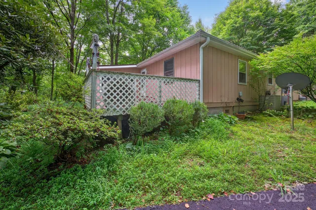 a side view of a house with a yard