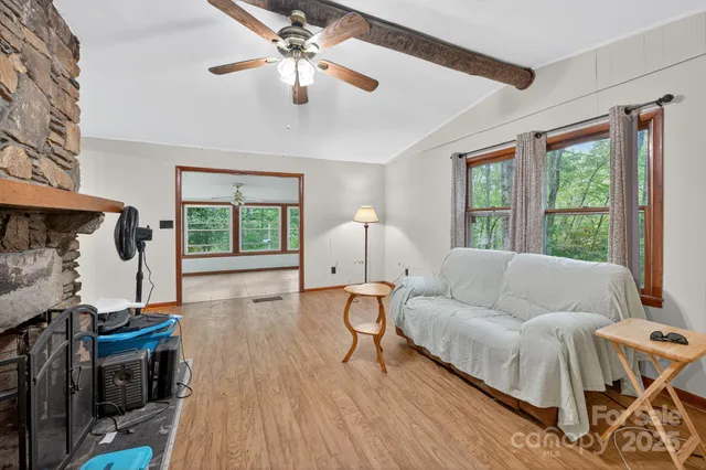 a living room with furniture and a large window