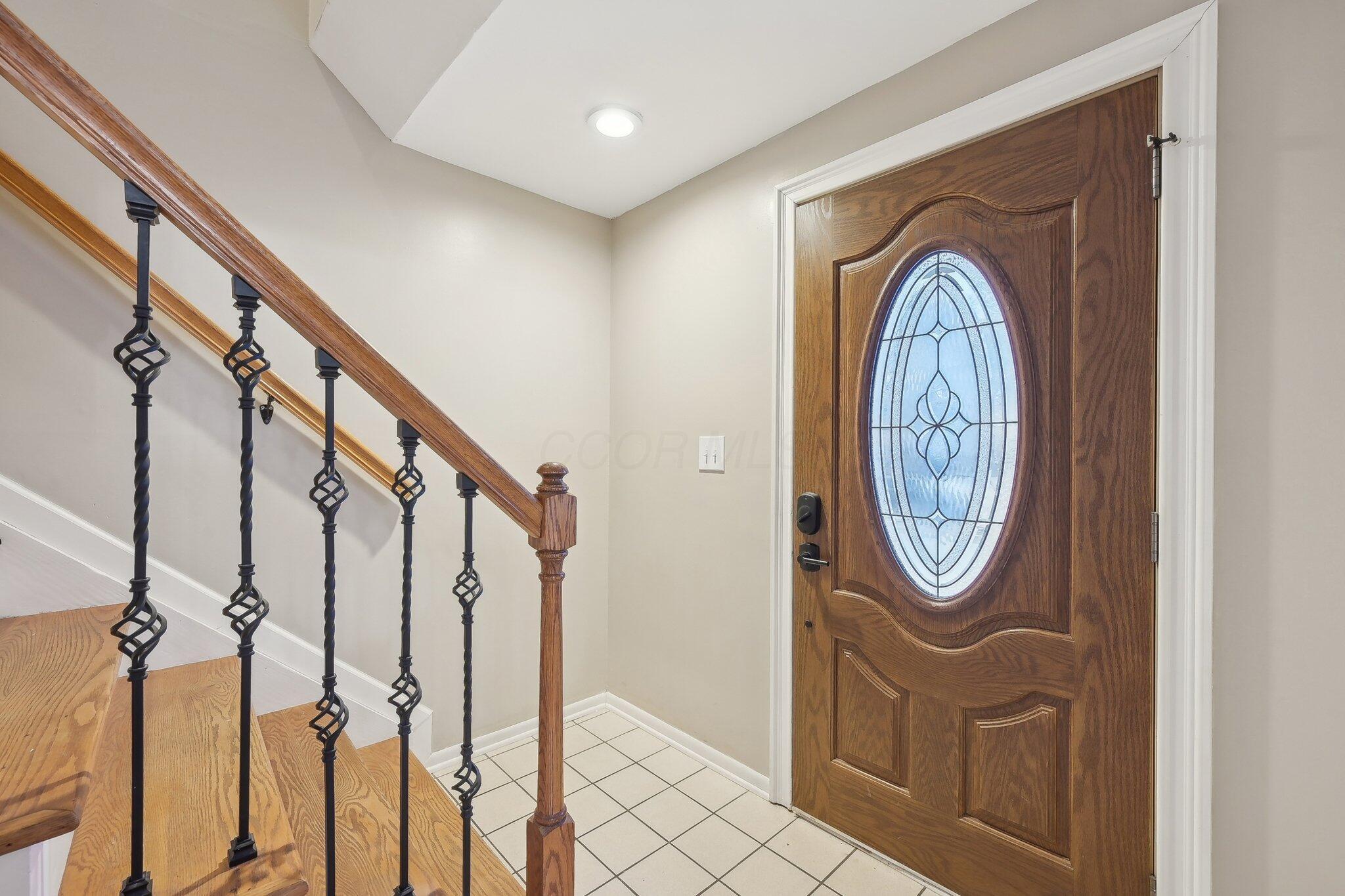 2475 Willis Road Dublin, OH 43016 - Photo 5 of 52 with wrought iron railings & wood stairs