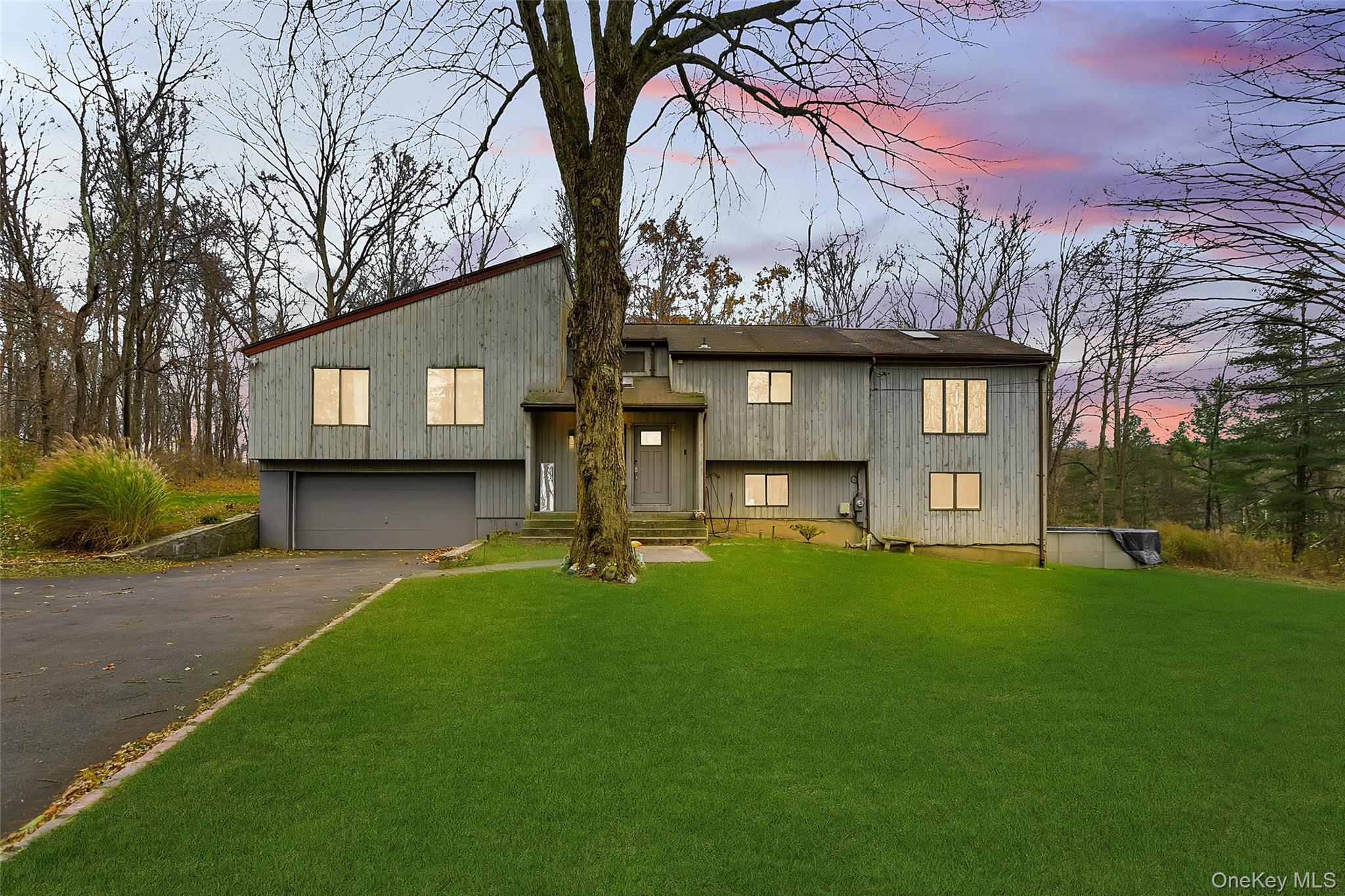1845 Jacob Road Cortlandt Manor, NY 10567 - Photo 1 of 38 a house view with a garden space