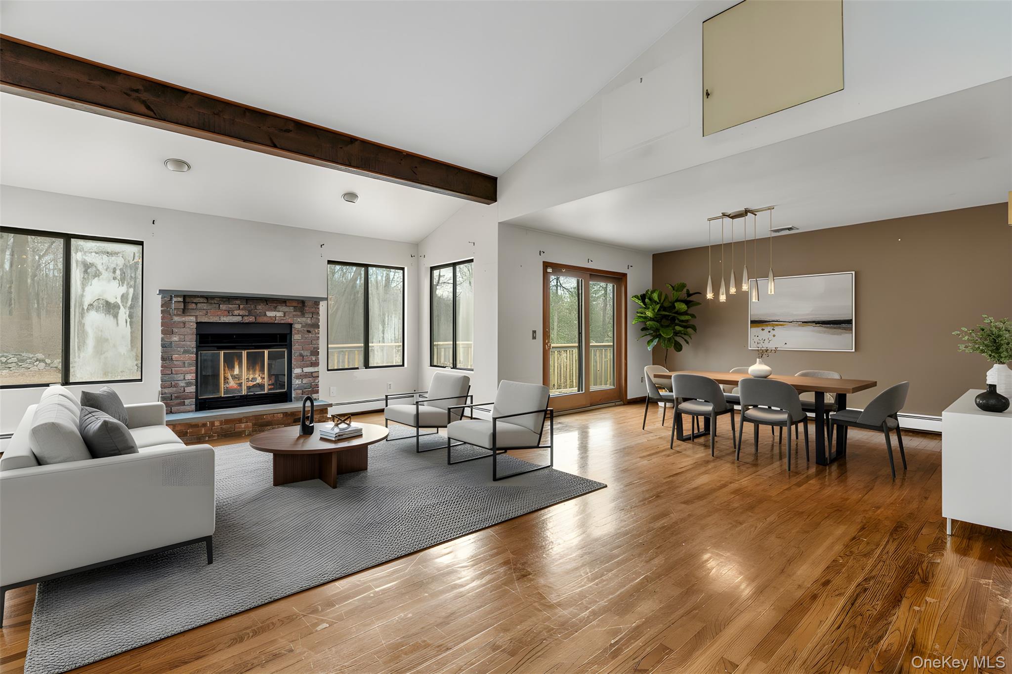 1845 Jacob Road Cortlandt Manor, NY 10567 - Photo 2 of 38 a living room with fireplace furniture and a wooden floor