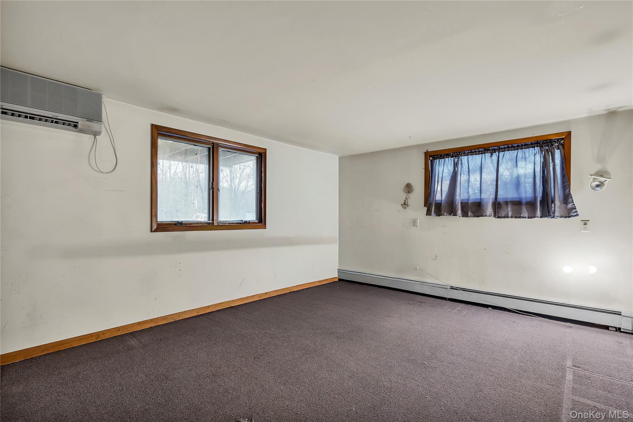 1845 Jacob Road Cortlandt Manor, NY 10567 - Photo 27 of 38 an empty room with windows