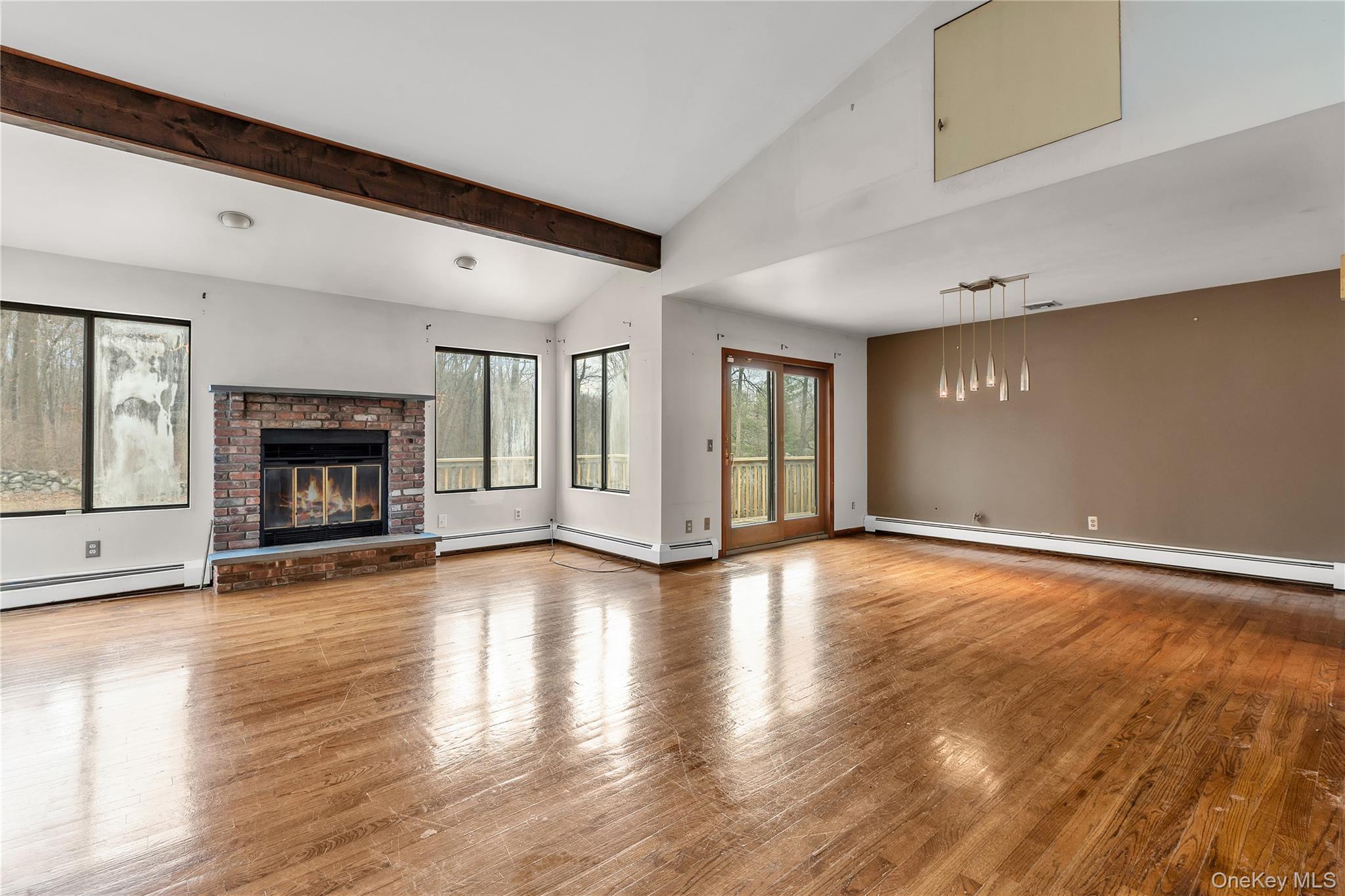 1845 Jacob Road Cortlandt Manor, NY 10567 - Photo 3 of 38 a view of an empty room with window and fire place