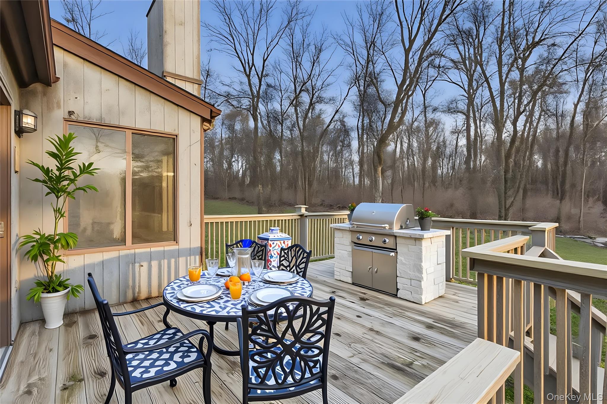 1845 Jacob Road Cortlandt Manor, NY 10567 - Photo 31 of 38 a backyard of a house with barbeque oven table and chairs