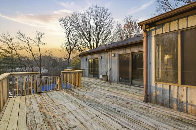 a view of a wooden deck with a patio