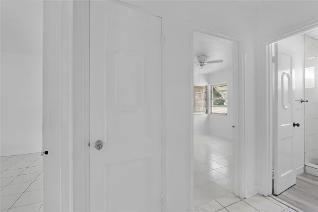a view of a chandelier fan in a room