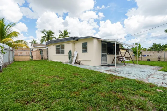 a view of a backyard of the house