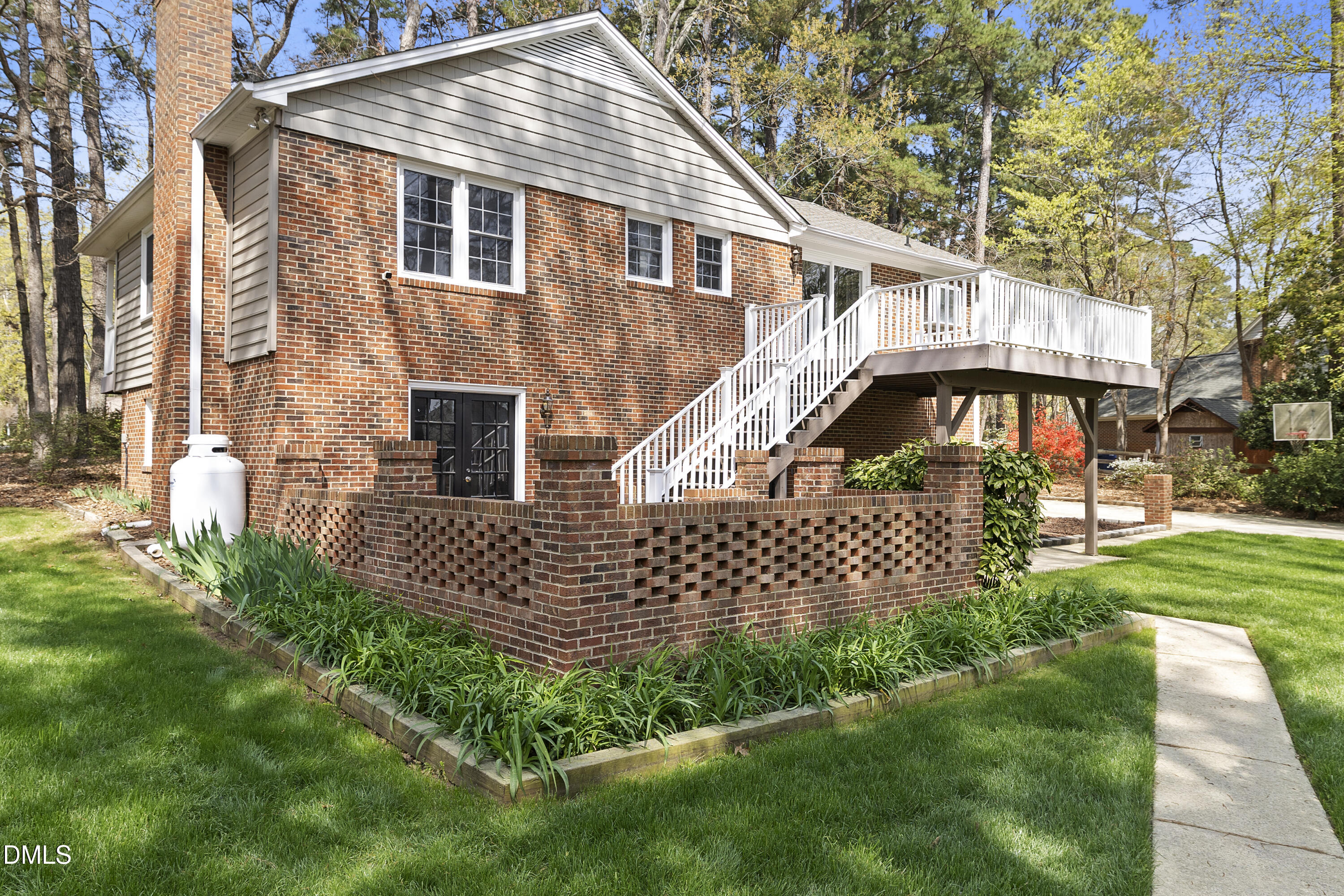 1821 Owls Nest Road Sanford, NC 27330 - Photo 19 of 77 a front view of a house with garden
