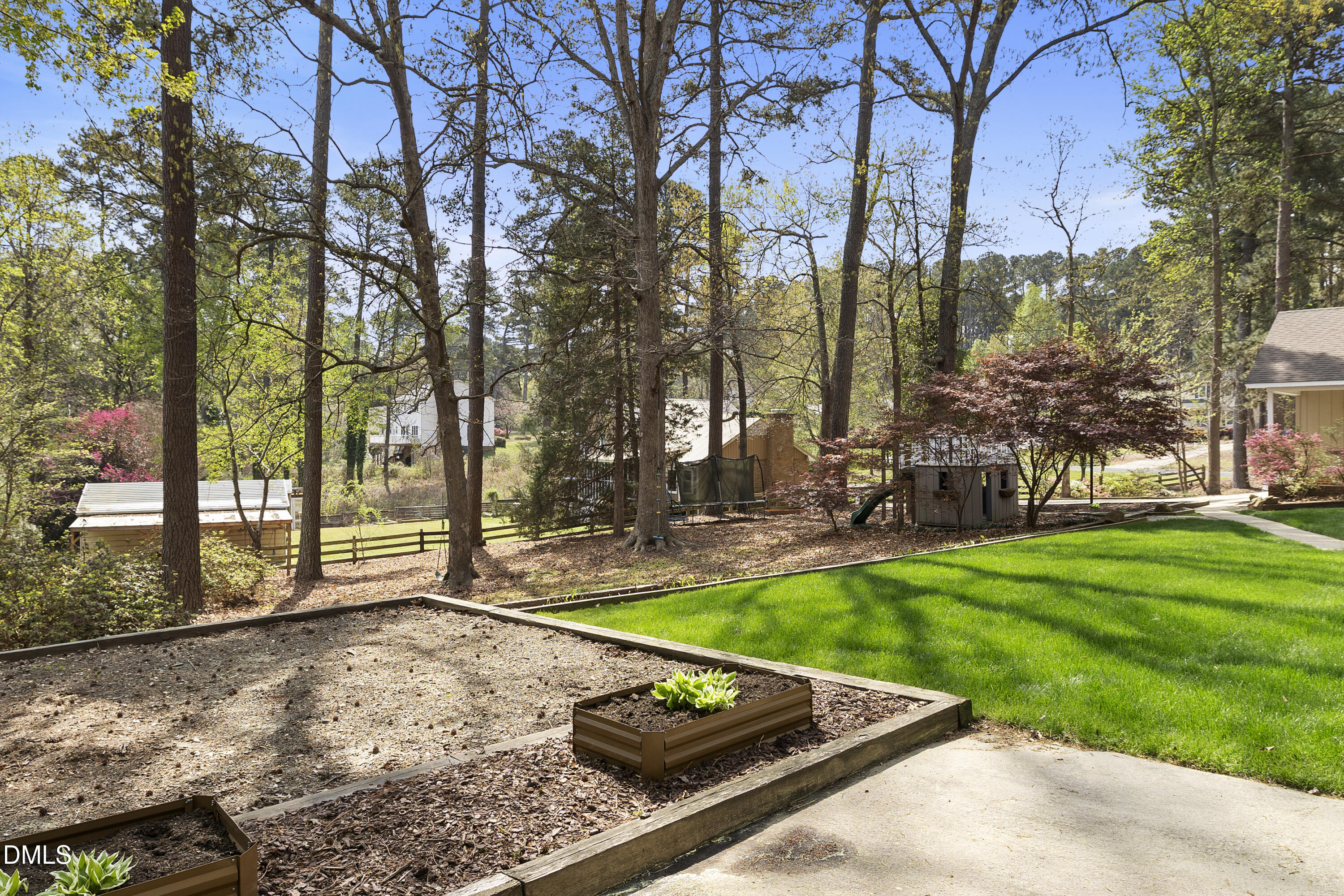 1821 Owls Nest Road Sanford, NC 27330 - Photo 23 of 77 a view of a backyard with large tree