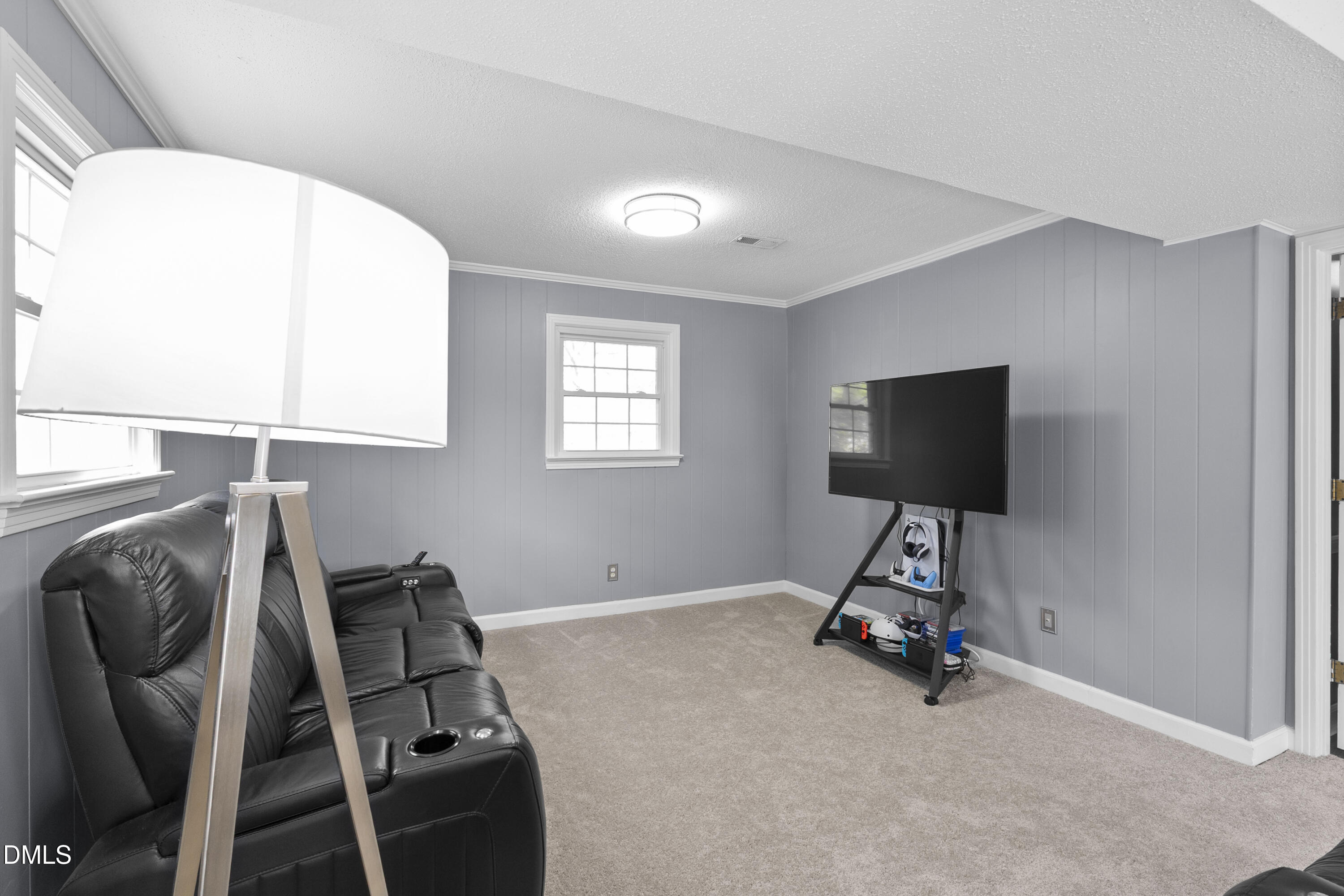 1821 Owls Nest Road Sanford, NC 27330 - Photo 37 of 77 a room with furniture and a flat screen tv