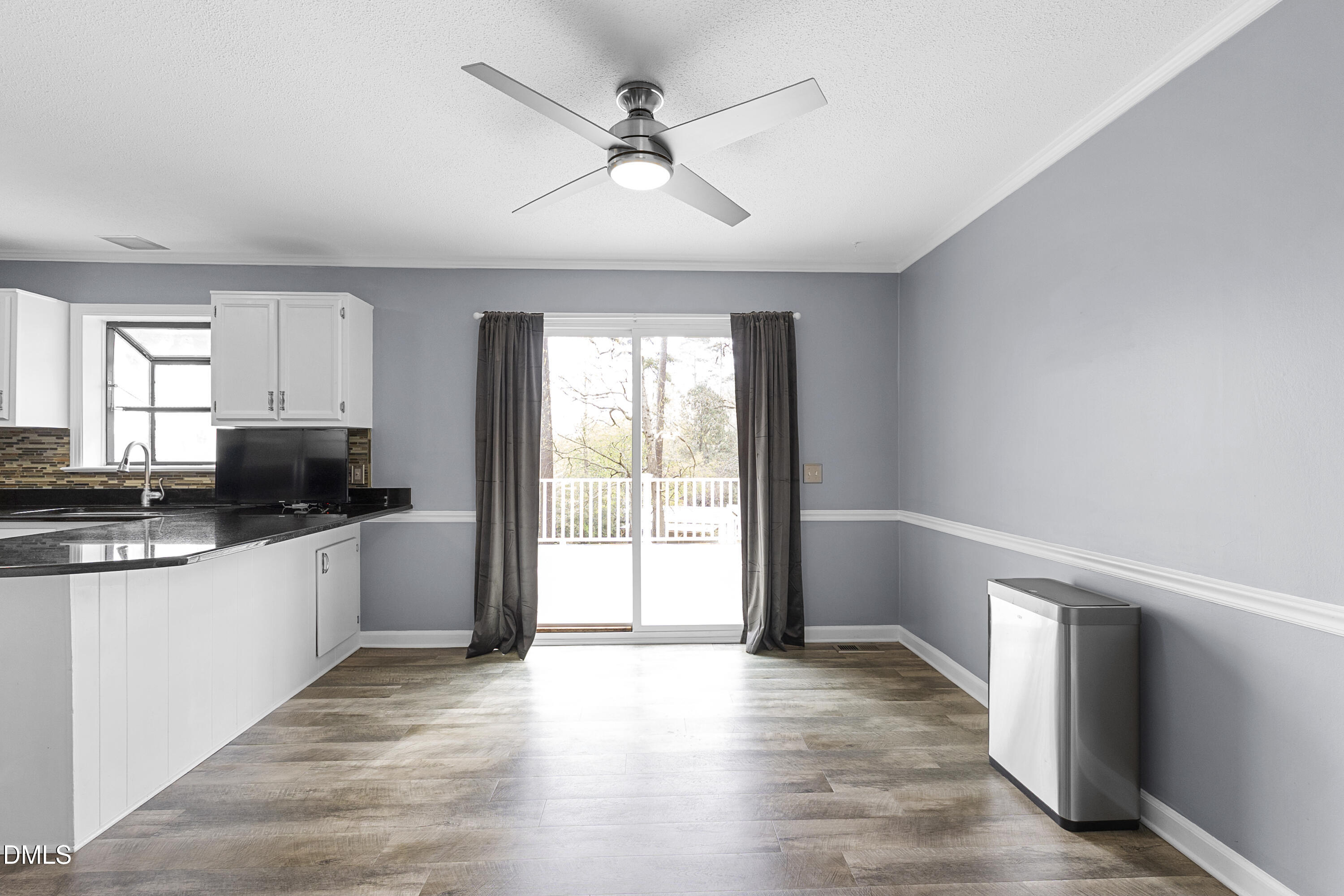 1821 Owls Nest Road Sanford, NC 27330 - Photo 43 of 77 a kitchen with stainless steel appliances granite countertop a stove a sink and a large window