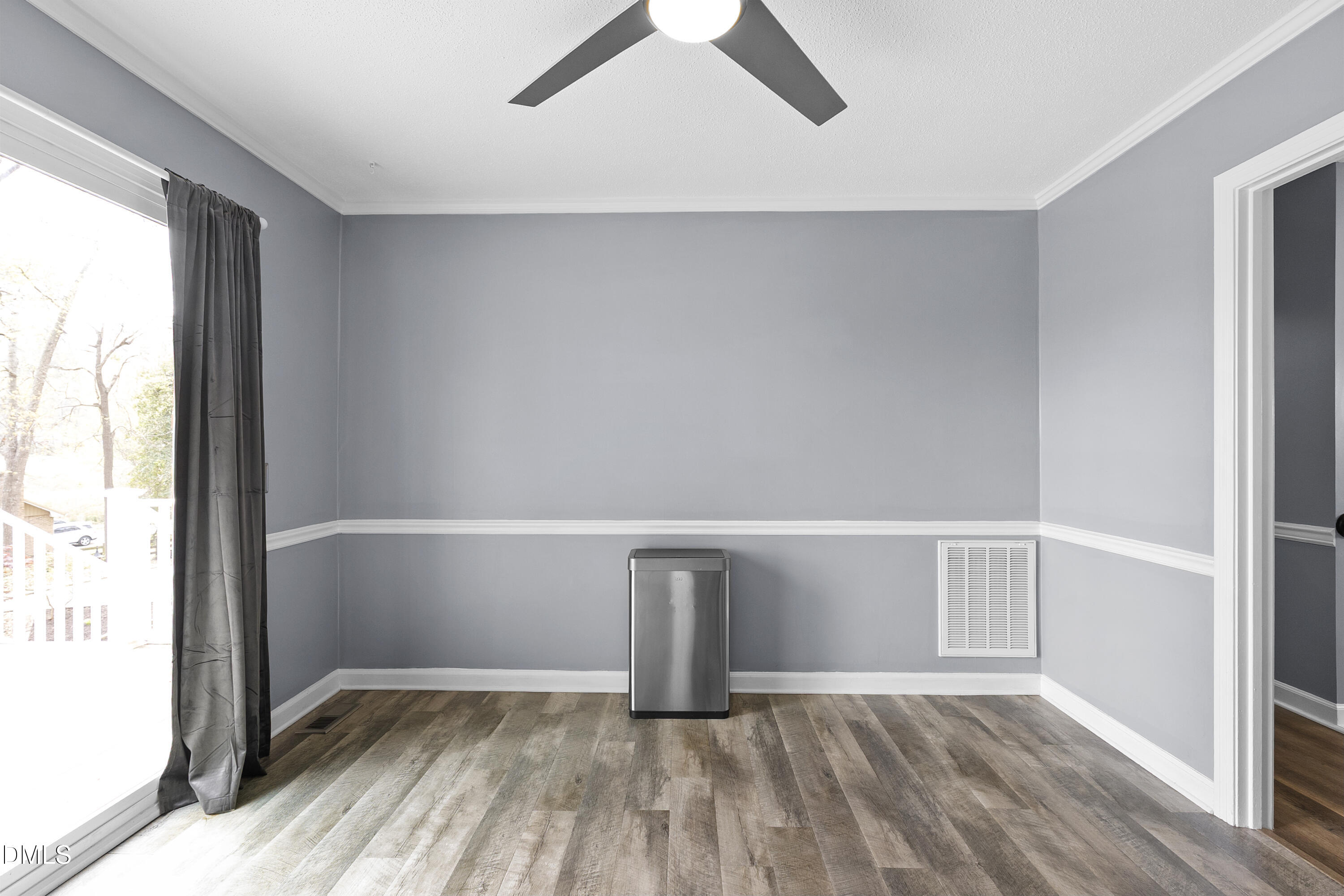 1821 Owls Nest Road Sanford, NC 27330 - Photo 44 of 77 a view of an empty room with wooden floor and a window