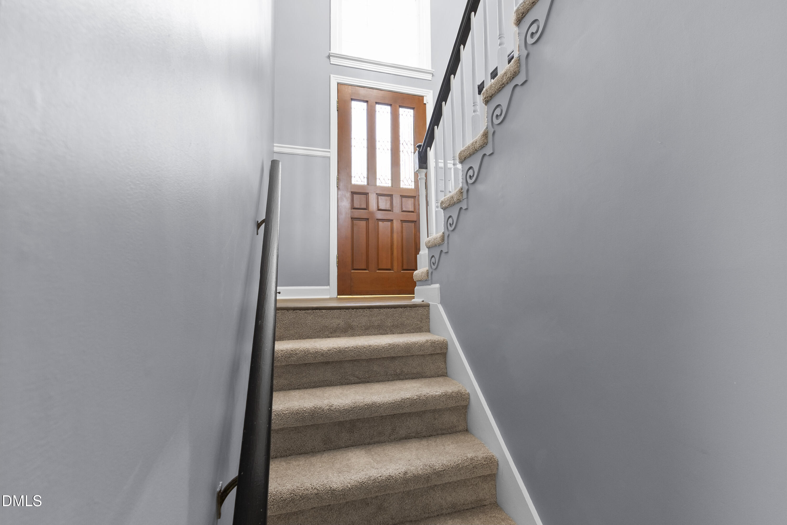 1821 Owls Nest Road Sanford, NC 27330 - Photo 46 of 77 a view of staircase with white walls and windows