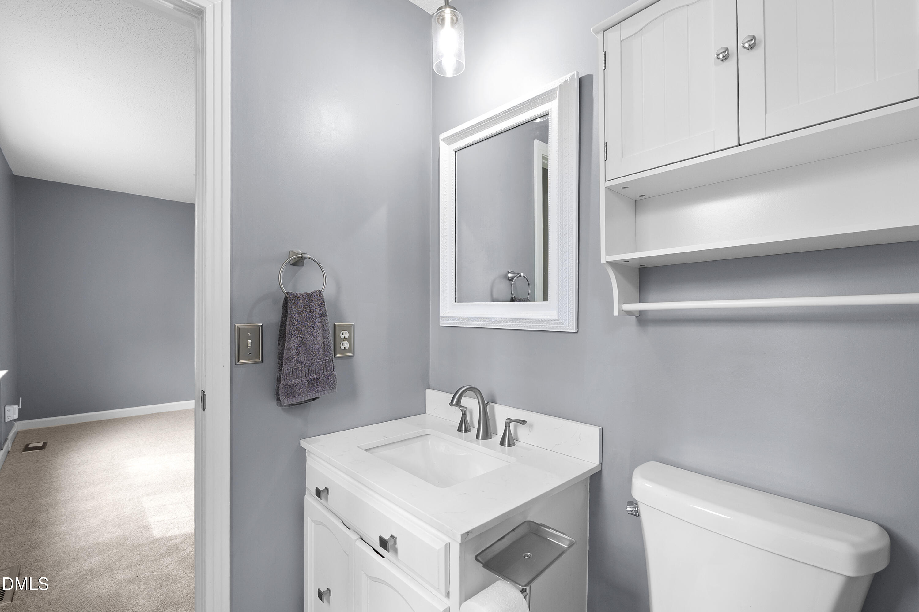 1821 Owls Nest Road Sanford, NC 27330 - Photo 69 of 77 a bathroom with a toilet sink and mirror