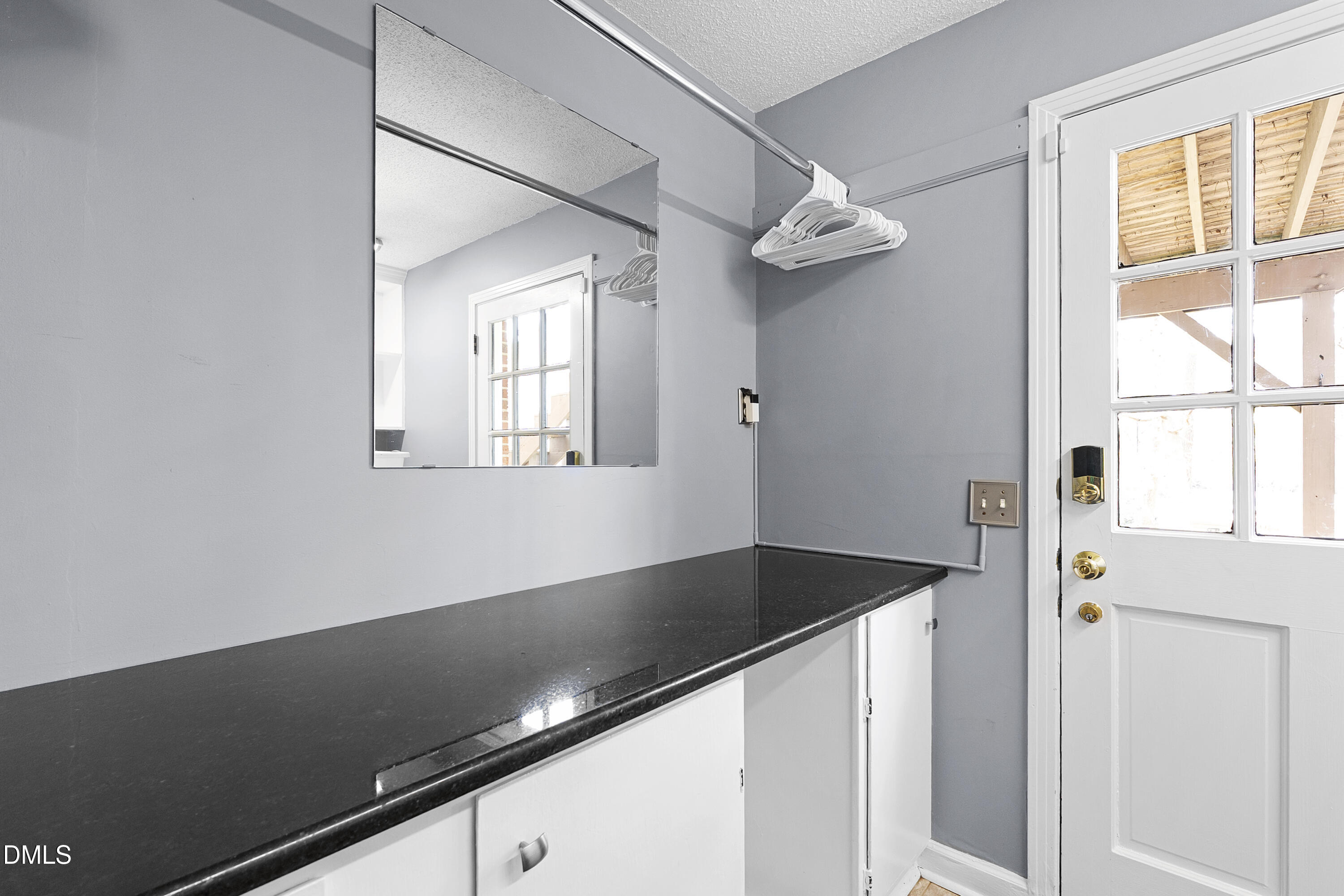 1821 Owls Nest Road Sanford, NC 27330 - Photo 74 of 77 a view of a hallway with windows and chandelier