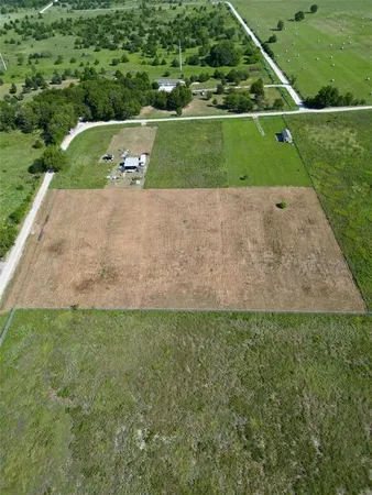 a view of a field with grass