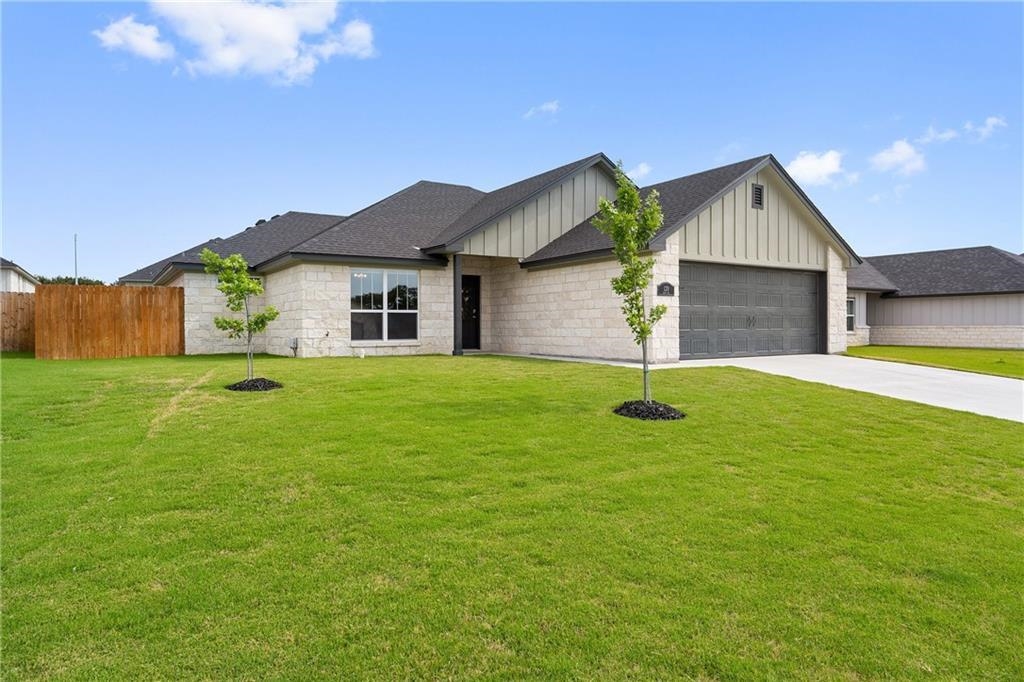 120 Elmer Avenue Burnet, TX 78611 - Photo 1 of 1 a house view with a garden space