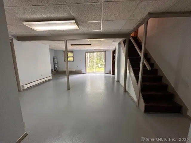 a view of gallery with wooden floor