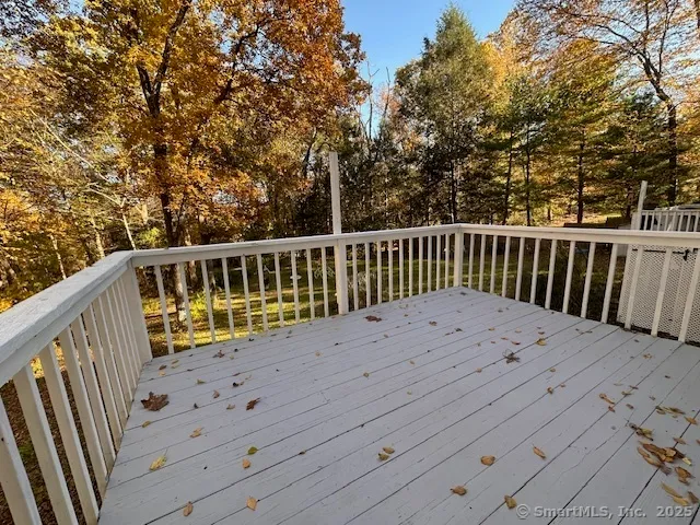 a view of balcony with wooden fence