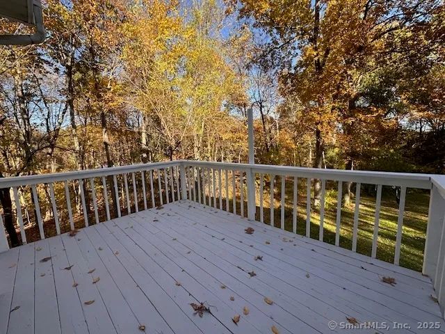 a view of balcony with wooden floor