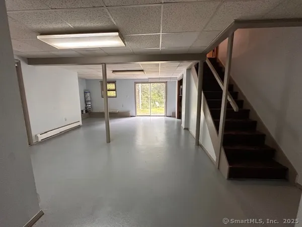 a view of gallery with wooden floor
