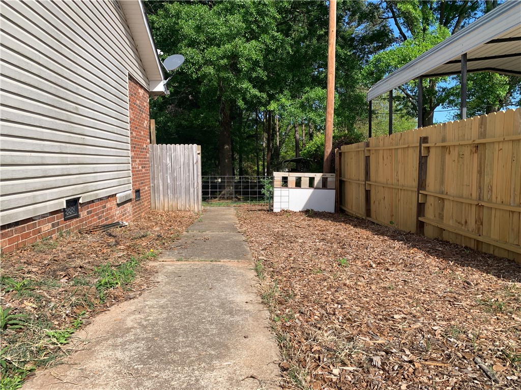224 Polaris Street Anderson, SC 29621 - Photo 26 of 30 This property features durable vinyl and brick siding, a private yard, and secure wood fencing.