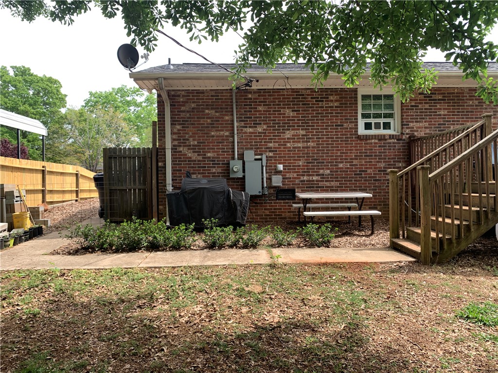 224 Polaris Street Anderson, SC 29621 - Photo 27 of 30 Side grilling and gathering space adjacent to deck.