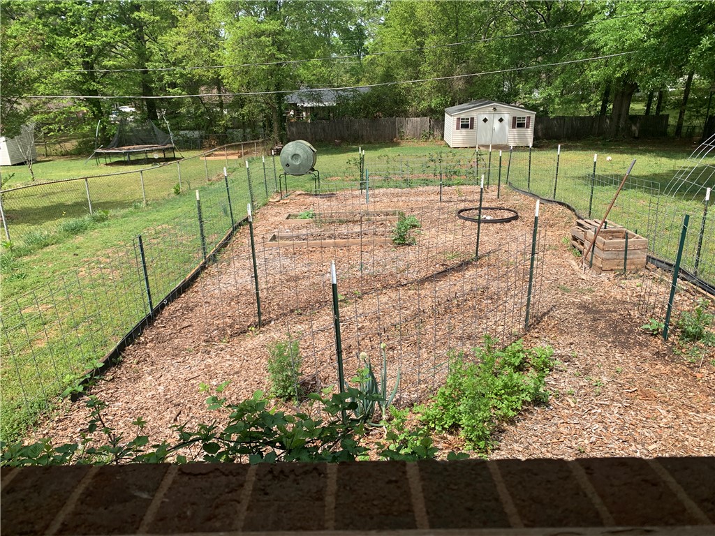 224 Polaris Street Anderson, SC 29621 - Photo 29 of 30 Multiple raised garden beds and trellising.