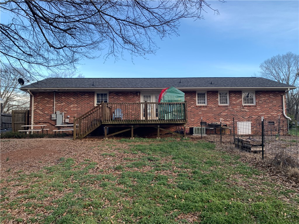224 Polaris Street Anderson, SC 29621 - Photo 30 of 30 This classic brick home features an expansive wooden deck, perfect for outdoor living.