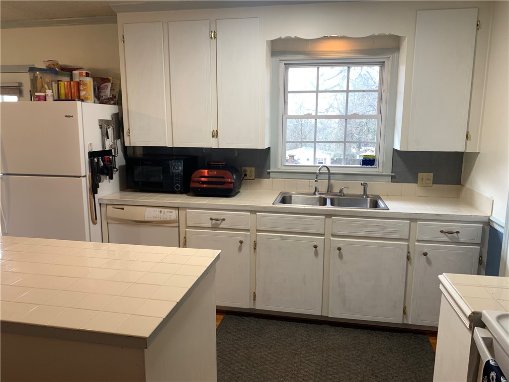 224 Polaris Street Anderson, SC 29621 - Photo 9 of 30 Kitchen features ample counter space and classic double-basin sink.