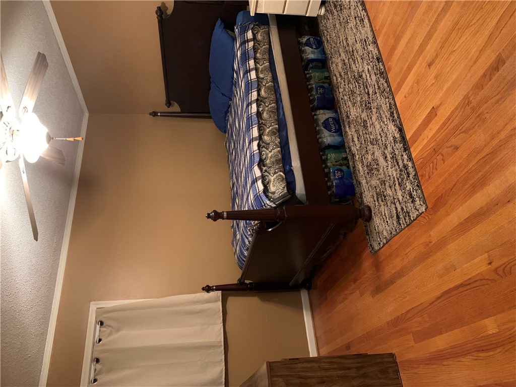 224 Polaris Street Anderson, SC 29621 - Photo 10 of 30 Spacious back bedroom with ceiling fan and direct view of garden.