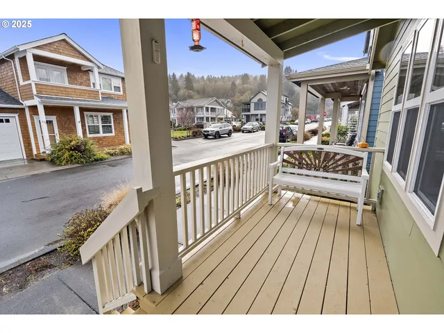 a view of a porch with wooden floor