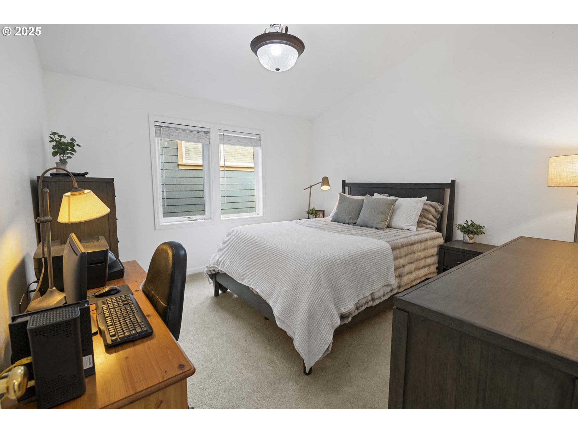 265 23rd Street Astoria, OR 97103 - Photo 21 of 36 a bedroom with bed and window