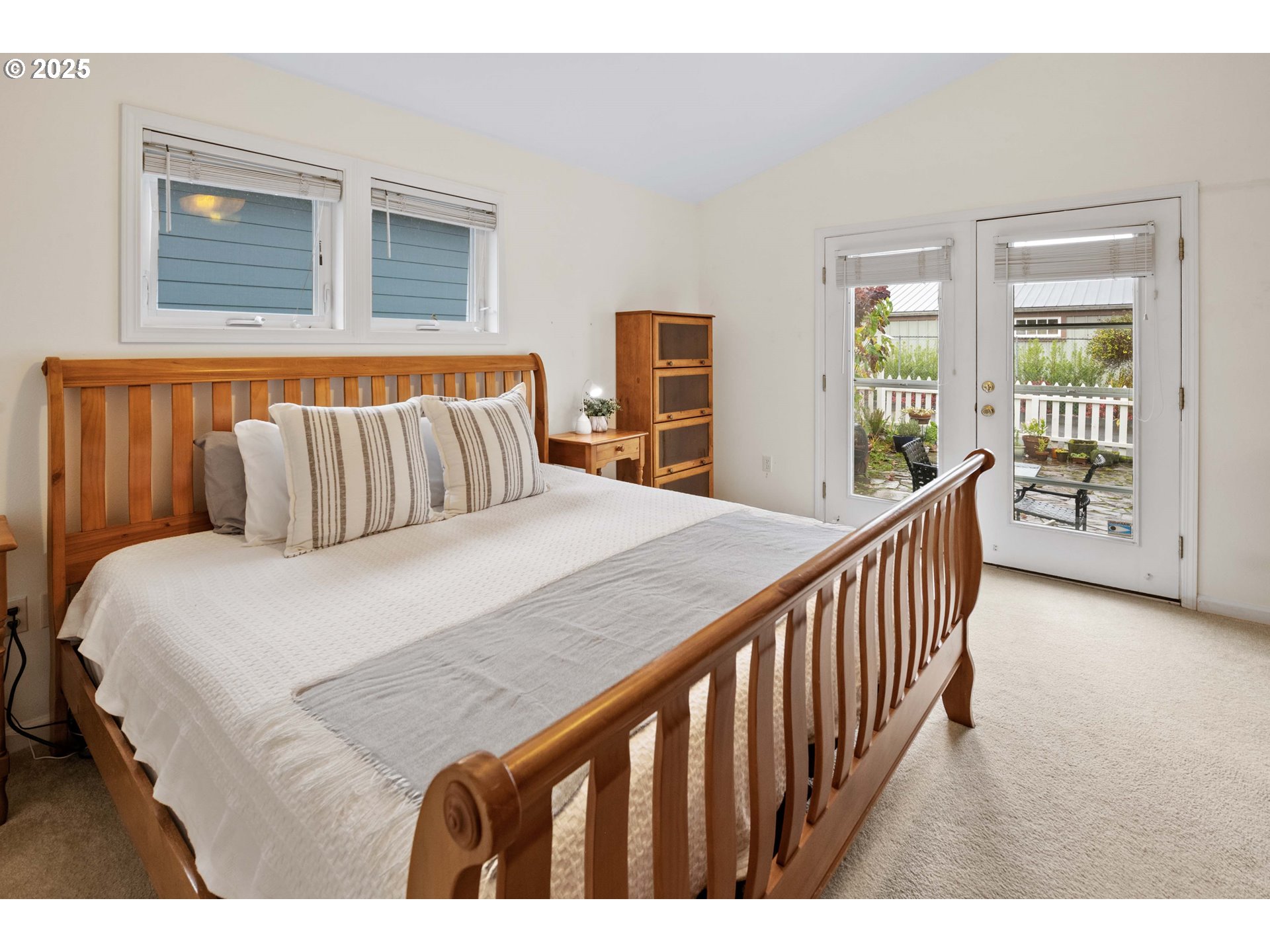 265 23rd Street Astoria, OR 97103 - Photo 27 of 36 a bedroom with a large bed and a window