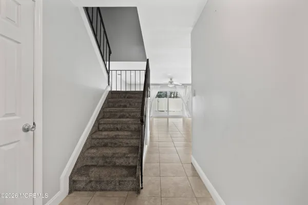 a view of empty room with a fireplace
