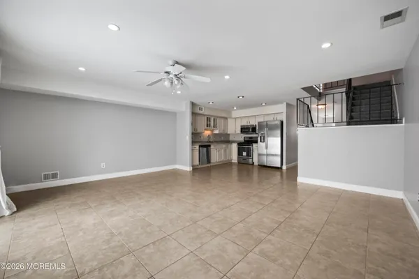 a view of a kitchen with furniture and a kitchen