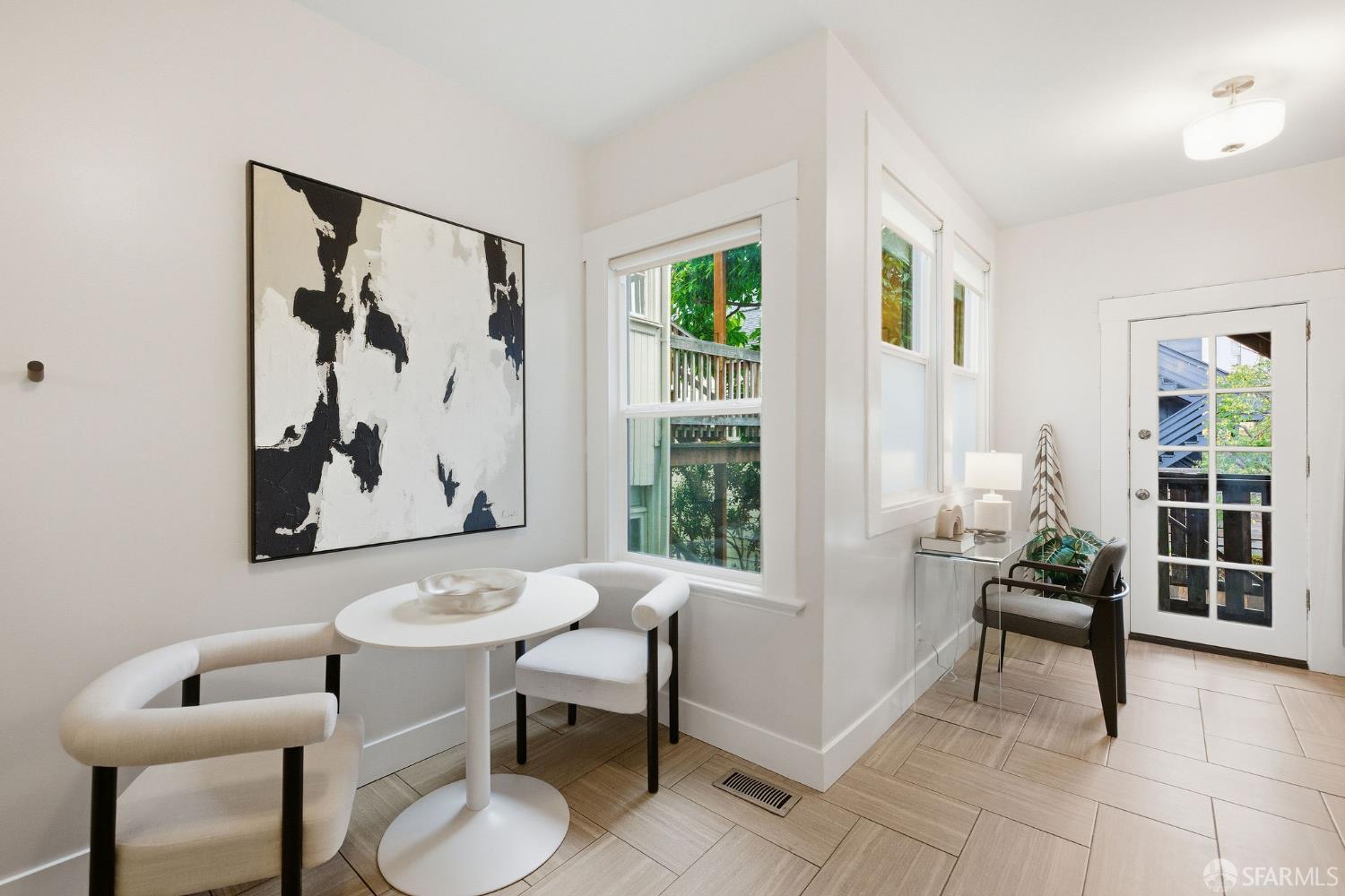 3452 18th Street, Unit A San Francisco, CA 94110 - Photo 11 of 39 a living room with furniture and a window