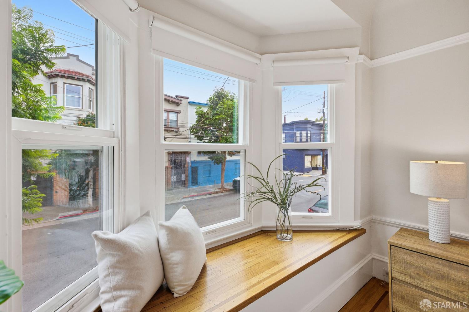 3452 18th Street, Unit A San Francisco, CA 94110 - Photo 21 of 39 a living room with furniture and a table