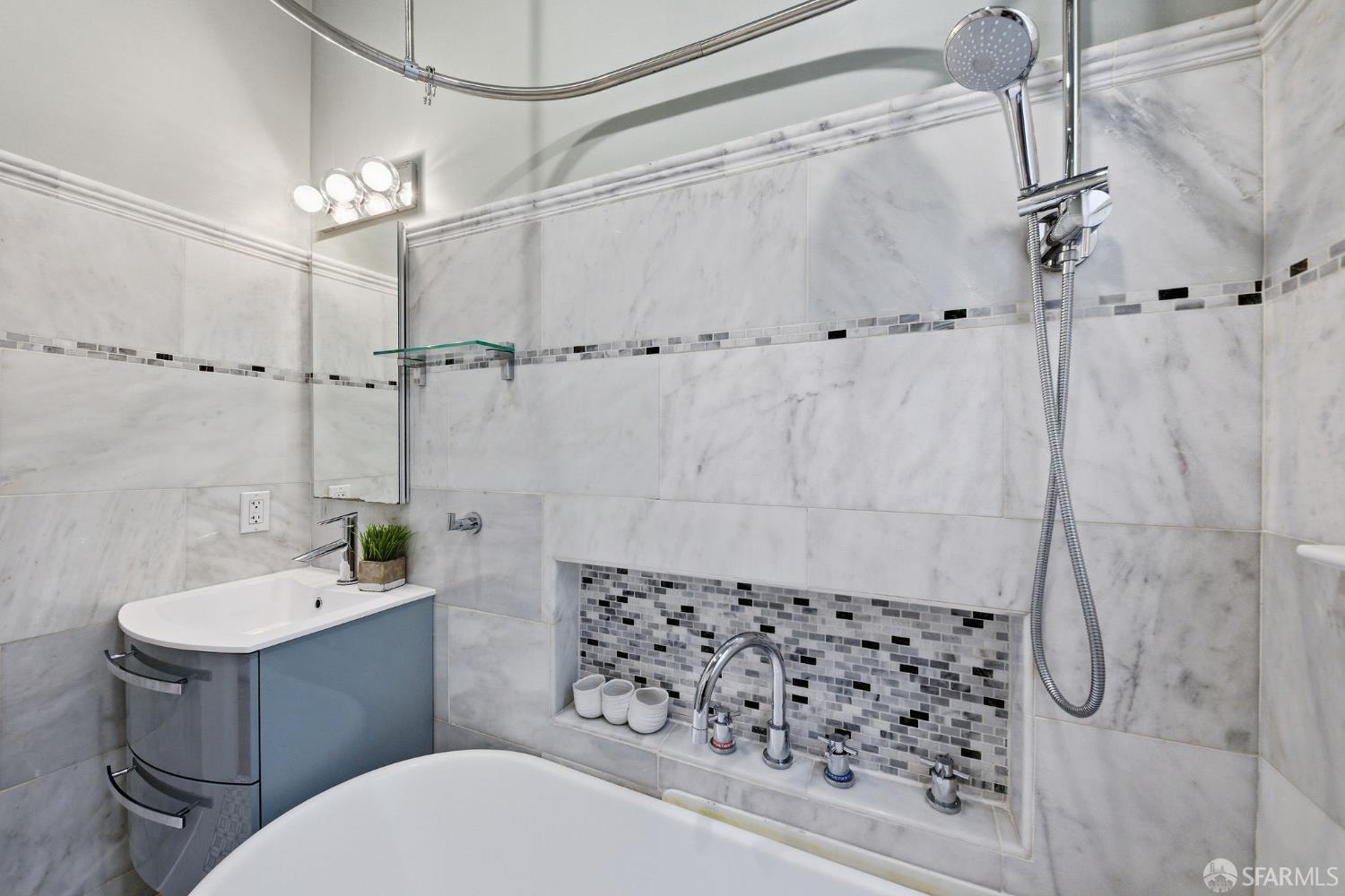 3452 18th Street, Unit A San Francisco, CA 94110 - Photo 29 of 39 a bathroom with a sink toilet and shower