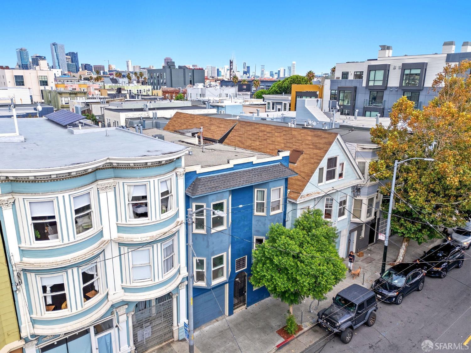 3452 18th Street, Unit A San Francisco, CA 94110 - Photo 3 of 39 a view of a city with tall buildings