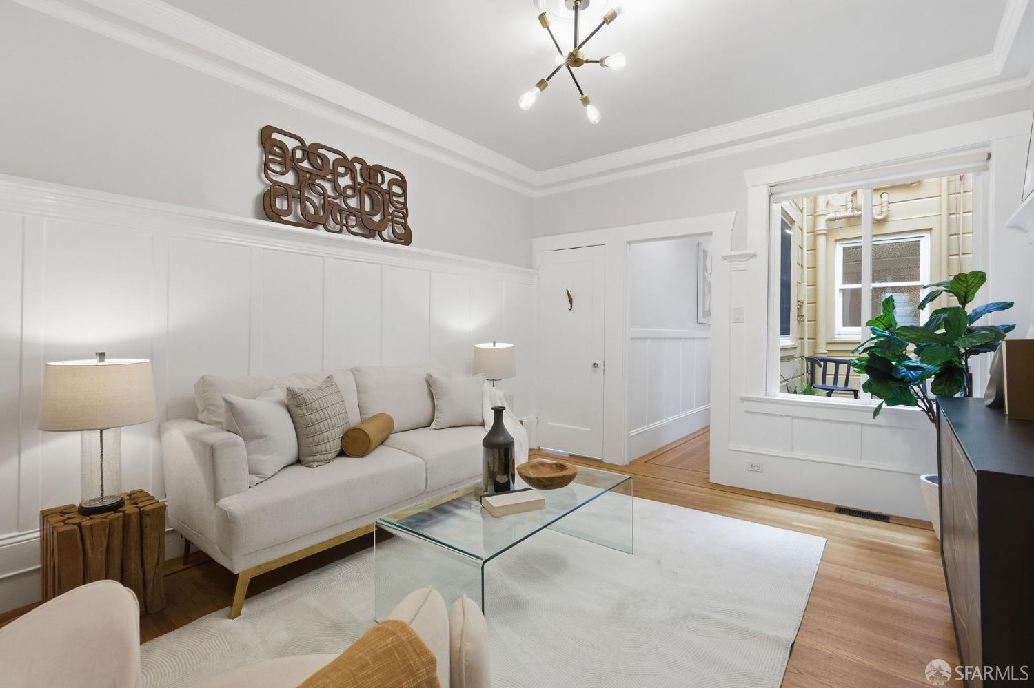 3452 18th Street, Unit A San Francisco, CA 94110 - Photo 6 of 39 a living room with furniture and a potted plant