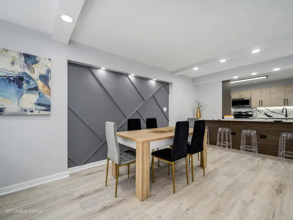 a kitchen with a sink a stove top oven and stainless steel appliances