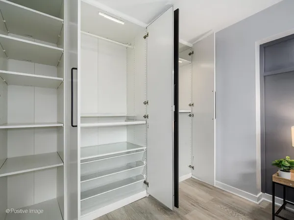 a bedroom with a large bed and a large window