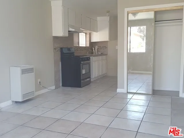 a kitchen with stainless steel appliances a sink and cabinets