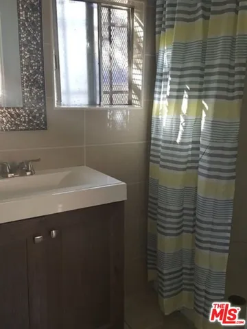 a bathroom with a sink and a shower