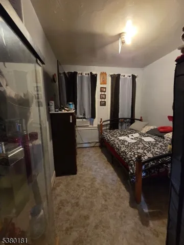 a bedroom with a bed and a mirror